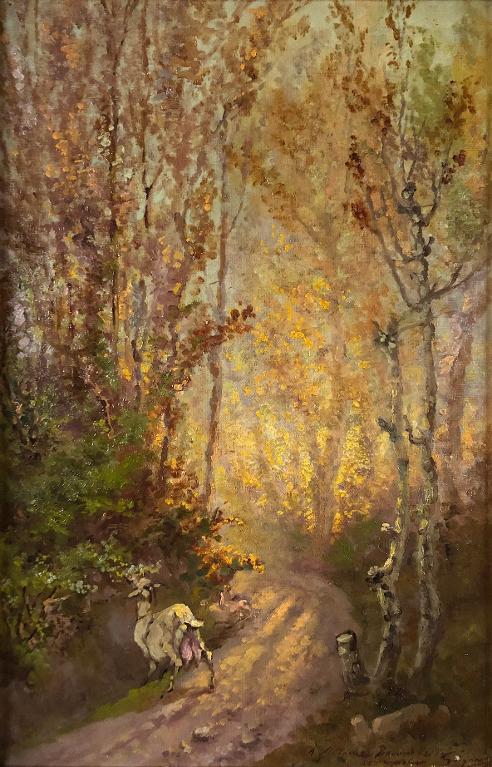 Chemin sous bois avec une chèvre